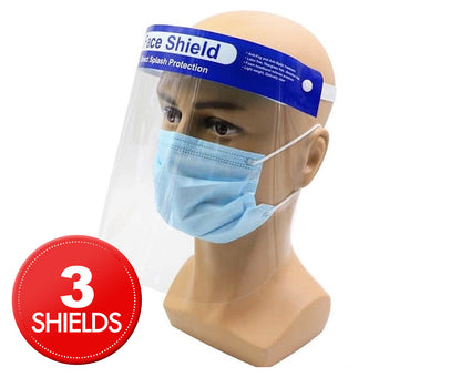 A mannequin head wears a blue surgical mask and a clear face shield with "Face Shield" written on the forehead band. The face shield, made from durable materials, features an anti-fog PET film. A red circular label with white text in the bottom left corner reads "3x Safety Full Face Shield Clear Glasses Anti-Fog Eye Protector Shop Dental," promoting a pack of three face shields.