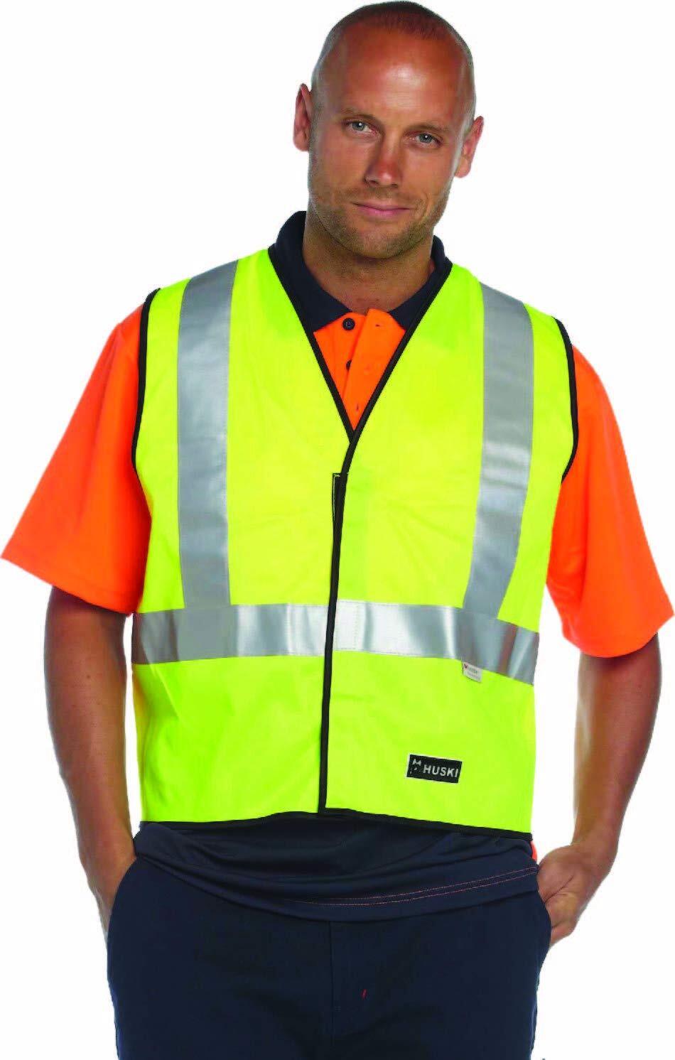 A man wearing a bright yellow HUSKI Hi Vis Patrol Vest 3M Reflective Tape Safety Workwear High Visibility - Yellow - L over an orange shirt, posing with his hands in his pockets. The vest has silver 3M reflective tape and a black border, and there is a small label that reads "Huski" at the bottom.