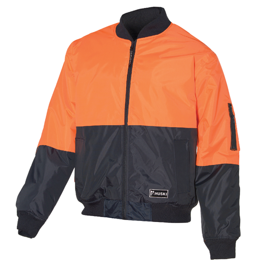 A high-visibility bomber jacket with an orange top half and a dark blue bottom half. This waterproof jacket features a front zipper, ribbed cuffs, and hem, with a small pocket on the left sleeve. The quilted lining adds extra warmth, and the "Huski" brand logo is visible on the bottom left front. The HUSKI 3M Flyer Fully Waterproof Bomber Jacket Hi Vis Work Quilted Lining - Orange - 6XL (132) ensures you stay visible and comfortable in challenging conditions.