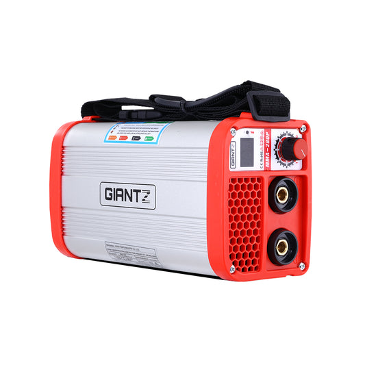 A compact, rectangular inverter welder with red protective ends and a silver body, labeled "Giantz 280 Amp Inverter Welder DC MMA ARC IGBT Stick Portable Welding Machine." Utilizing IGBT DC inverter technology, the front panel displays dials, ports, and indicators. A black strap is attached at the top for easy carrying. Ideal for MMA welding projects.