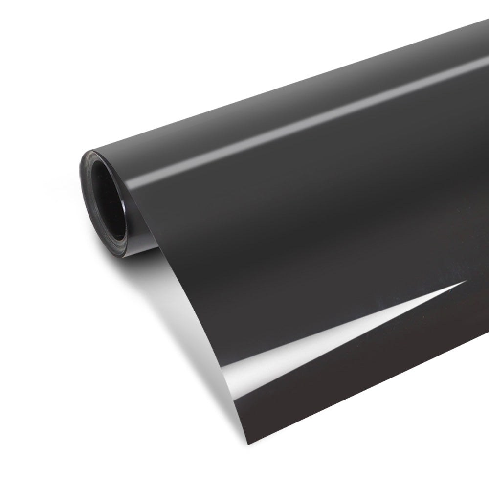 A close-up of a partially unrolled roll of Giantz Window Tint Film Black Roll 15% VLT Home House 76cm X 7m Tinting Tools. The material appears smooth with a slight reflective surface and offers UV resistance. The edge of the roll shows a clean cut, perfect for window tinting projects.